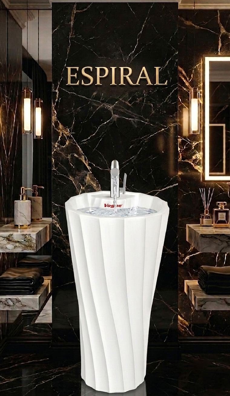 Espiral free-standing basin with twisting spiral flutes, against dark marble