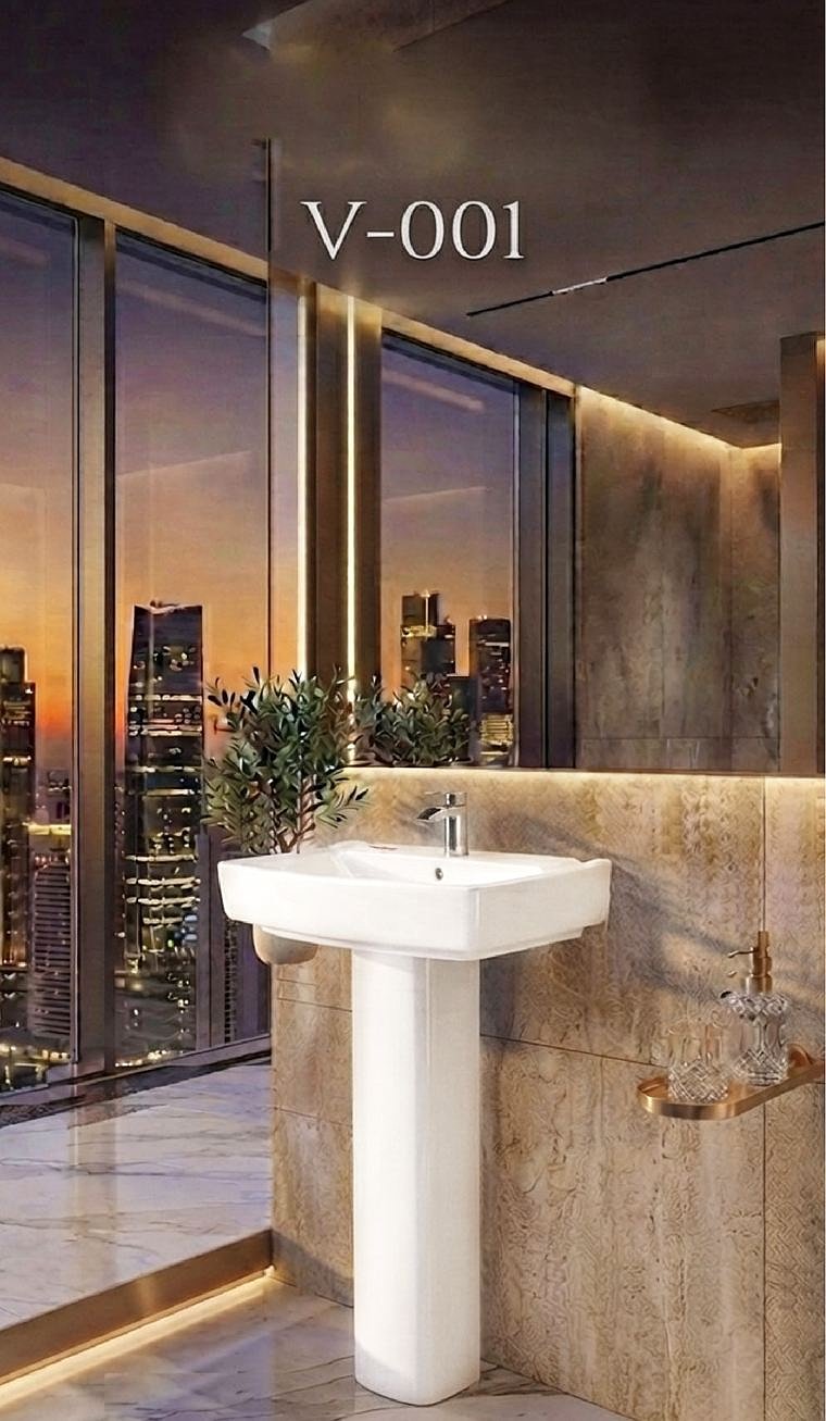 V-001 pedestal basin by a window overlooking a city at dusk